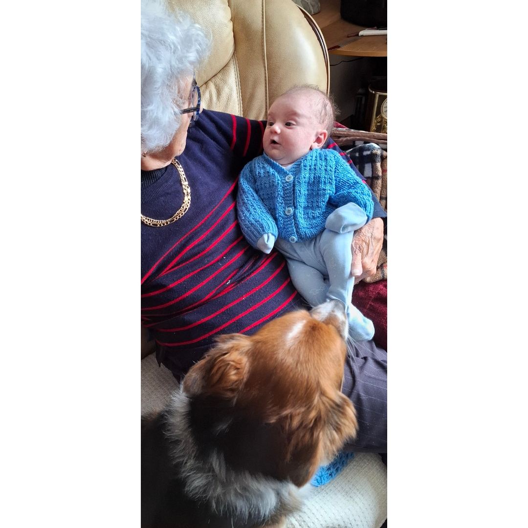 Jac having a good chin wagg with his great grandmother Joan, 93 years old and not forgetting Max the dog.png